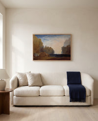 Rocky Bay by J. M. W. Turner framed in natural oak above a cream sofa in a warm living room