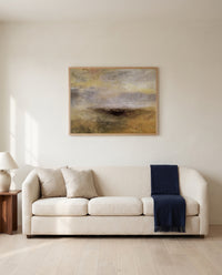 Storm Coming On by J. M. W. Turner framed in natural oak above a cream sofa in a warm living room