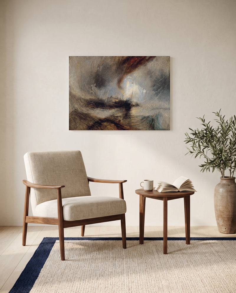 Snow Storm: Steam-Boat by J. M. W. Turner as a stretched canvas above a linen lounge chair in a reading corner