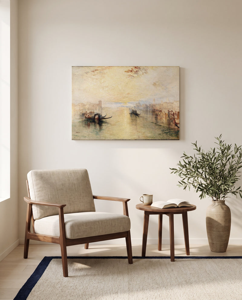 St Benedetto, Venice by J. M. W. Turner as a stretched canvas above a linen lounge chair in a reading corner