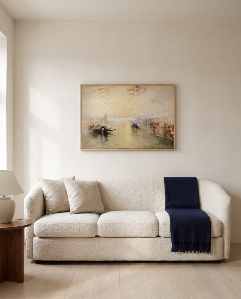 St Benedetto, Venice by J. M. W. Turner framed in natural oak above a cream sofa in a warm living room