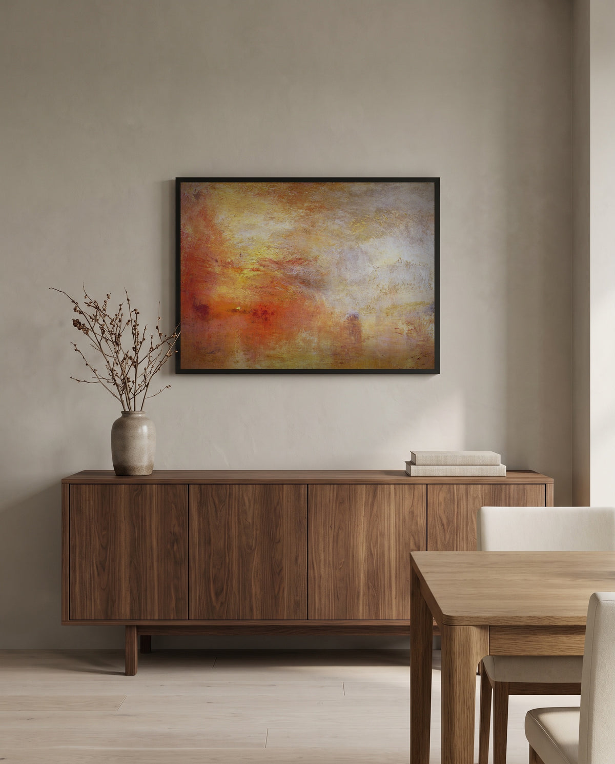Sun Setting over a Lake by J. M. W. Turner in a black frame above a walnut sideboard in a dining room