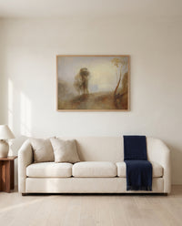 Castle on a Bay: Solitude by J. M. W. Turner framed in natural oak above a cream sofa in a warm living room