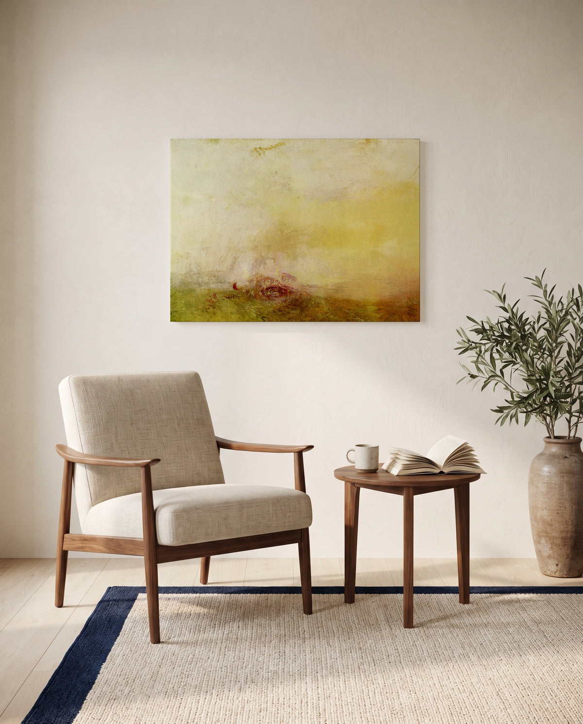 Sunrise with Sea Monsters by J. M. W. Turner as a stretched canvas above a linen lounge chair in a reading corner