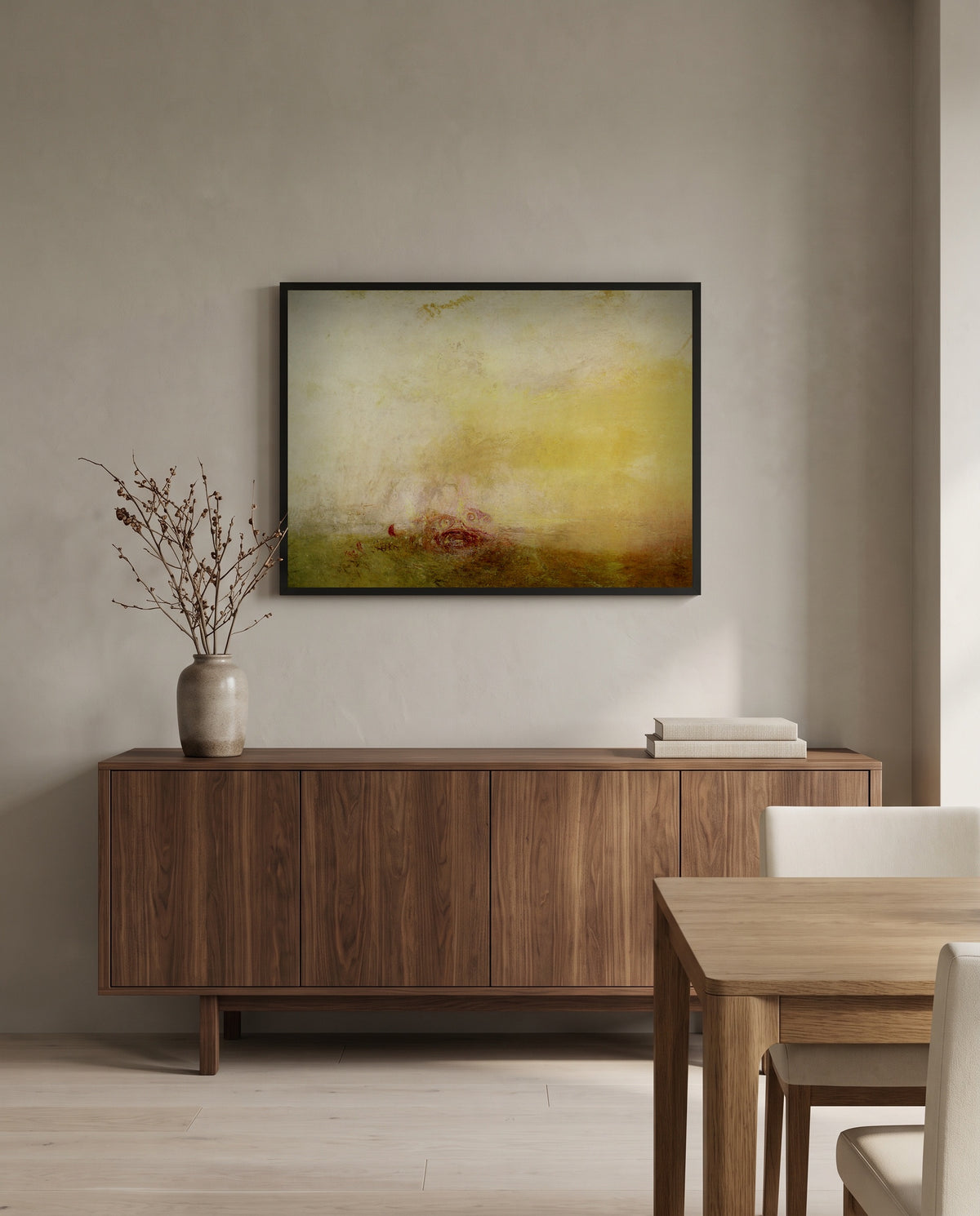 Sunrise with Sea Monsters by J. M. W. Turner in a black frame above a walnut sideboard in a dining room