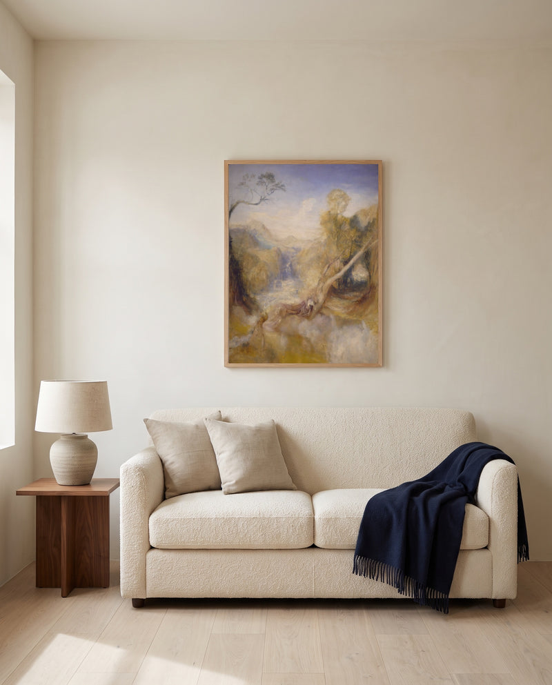 The Death of Actaeon by J. M. W. Turner framed in natural oak above a cream sofa in a warm living room
