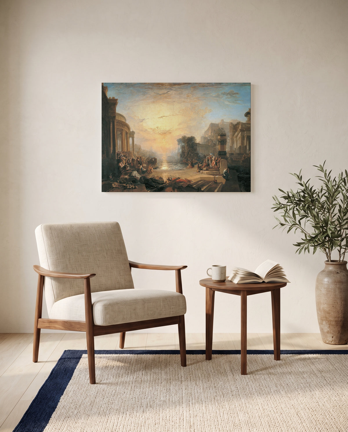 Decline of Carthage by J. M. W. Turner as a stretched canvas above a linen lounge chair in a reading corner