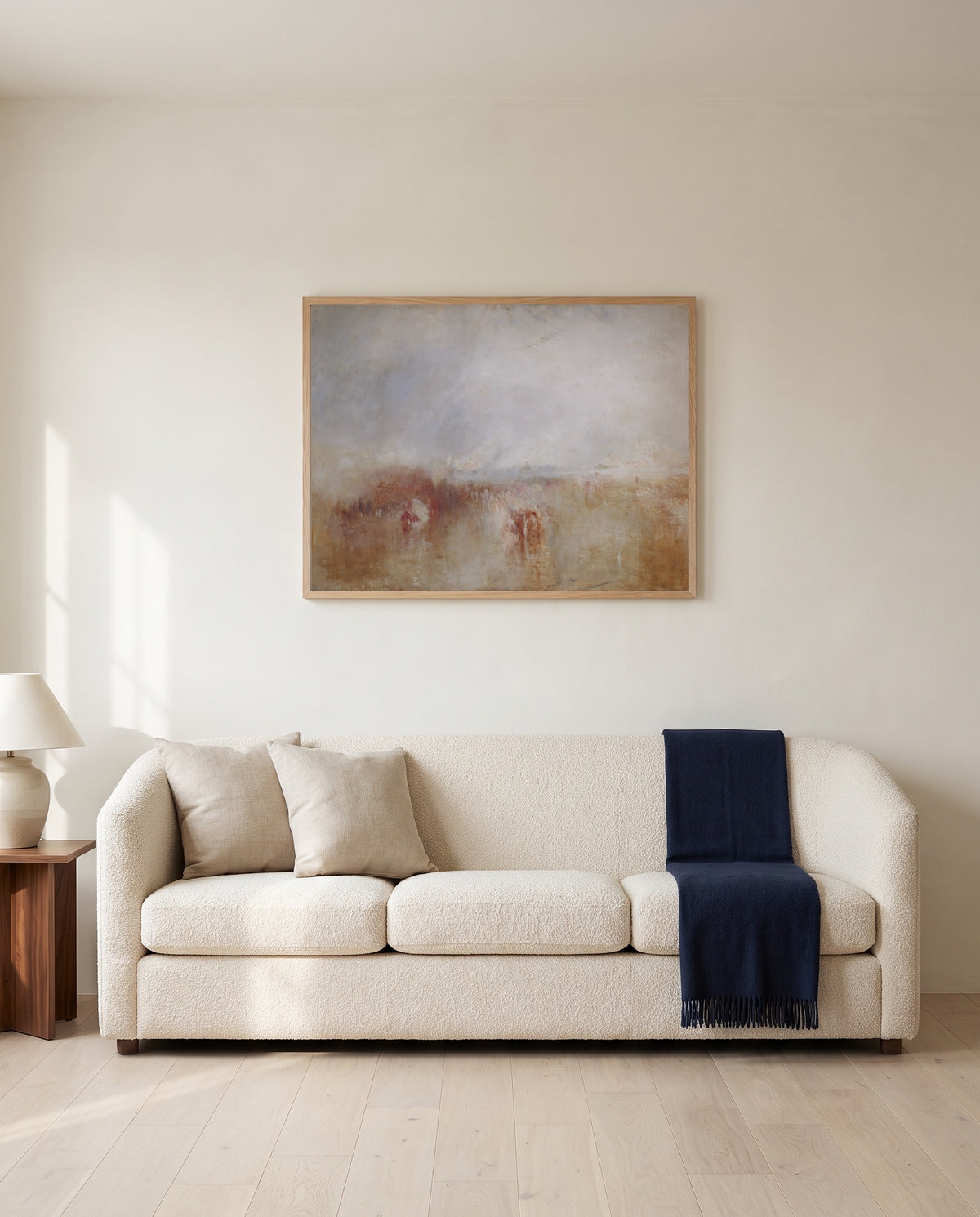 Louis-Philippe at Gosport by J. M. W. Turner framed in natural oak above a cream sofa in a warm living room