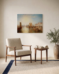 The Harbour of Dieppe by J. M. W. Turner as a stretched canvas above a linen lounge chair in a reading corner
