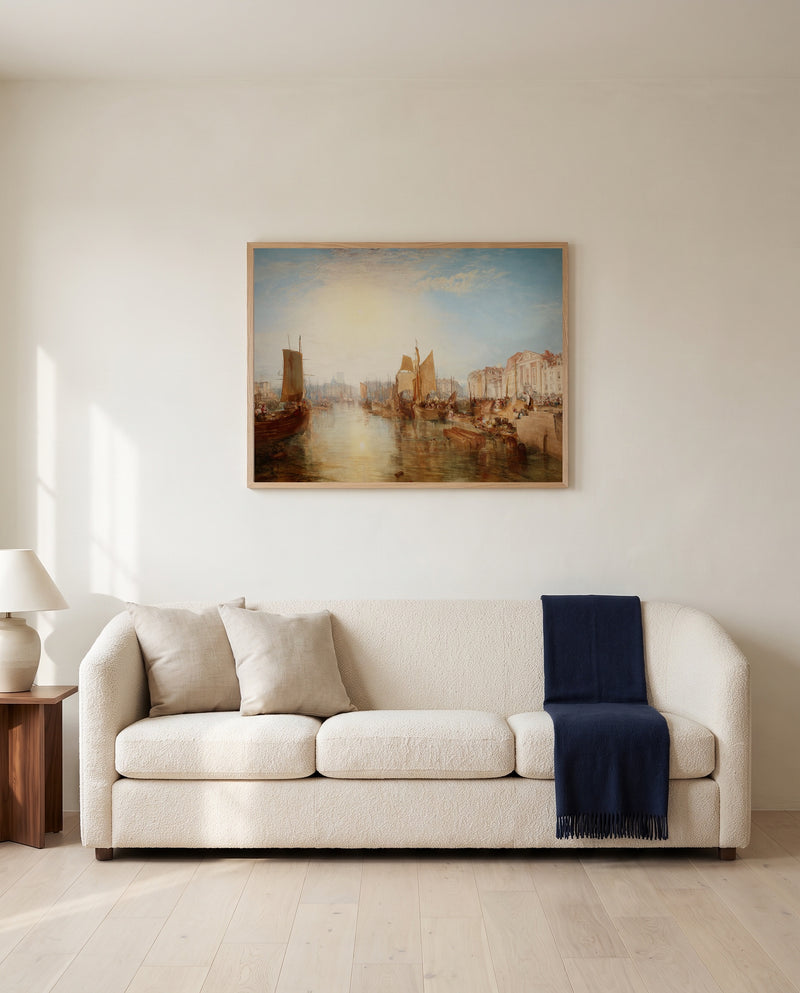 The Harbour of Dieppe by J. M. W. Turner framed in natural oak above a cream sofa in a warm living room