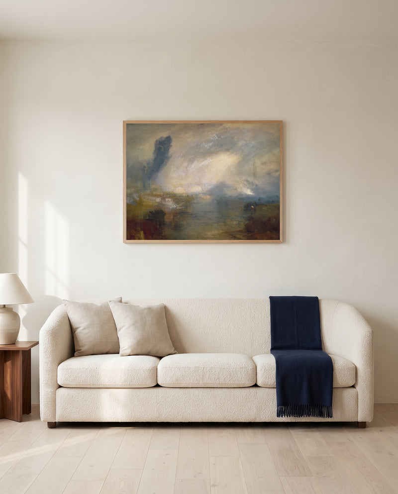 Thames above Waterloo Bridge by J. M. W. Turner framed in natural oak above a cream sofa in a warm living room