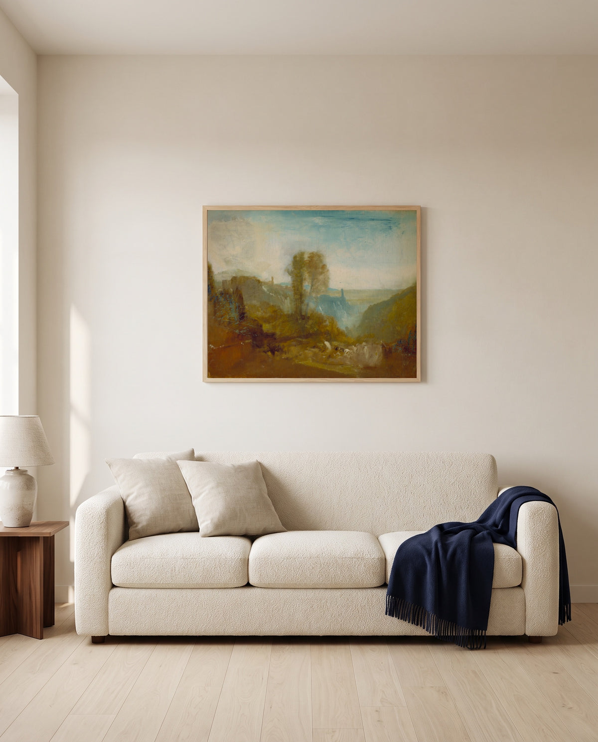 Tivoli, the Cascatelle by J. M. W. Turner framed in natural oak above a cream sofa in a warm living room