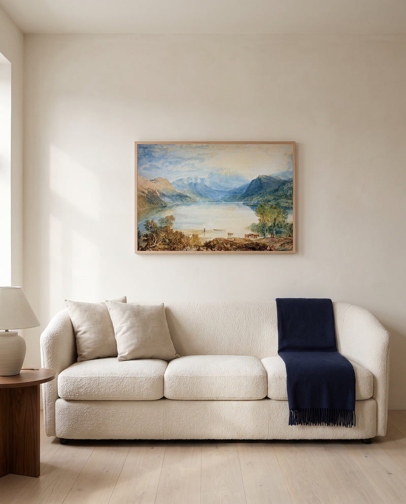 Ullswater by J. M. W. Turner framed in natural oak above a cream sofa in a warm living room