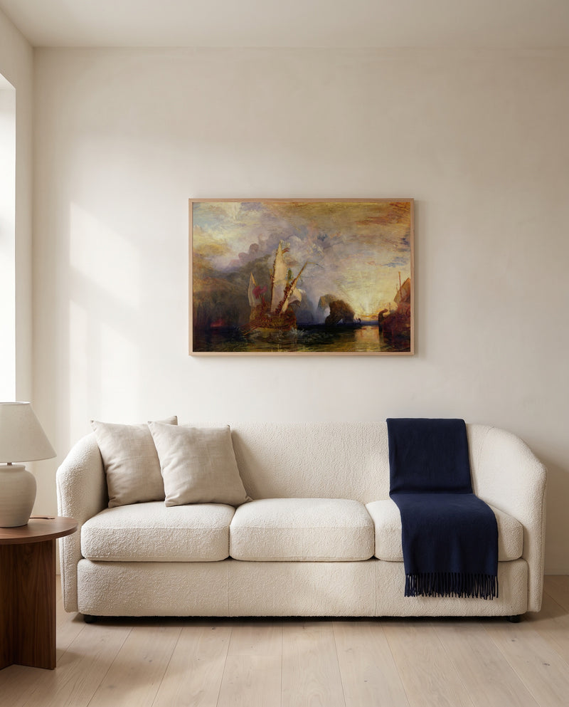 Ulysses Deriding Polyphemus by J. M. W. Turner framed in natural oak above a cream sofa in a warm living room