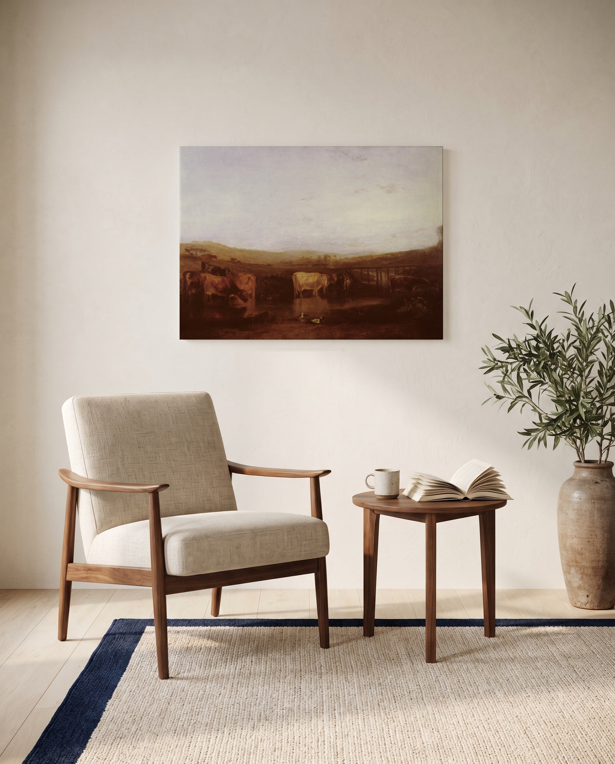 Union of the Thames and Isis by J. M. W. Turner as a stretched canvas above a linen lounge chair in a reading corner