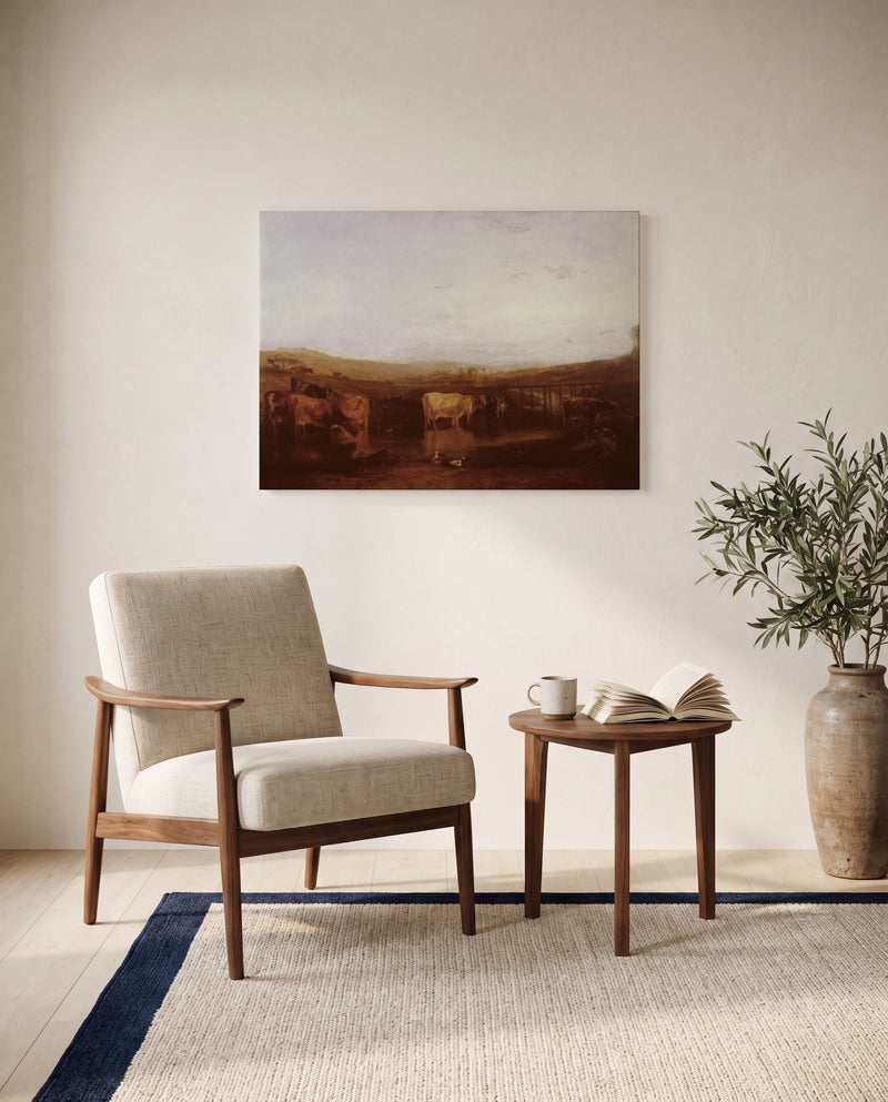 Union of the Thames and Isis by J. M. W. Turner as a stretched canvas above a linen lounge chair in a reading corner