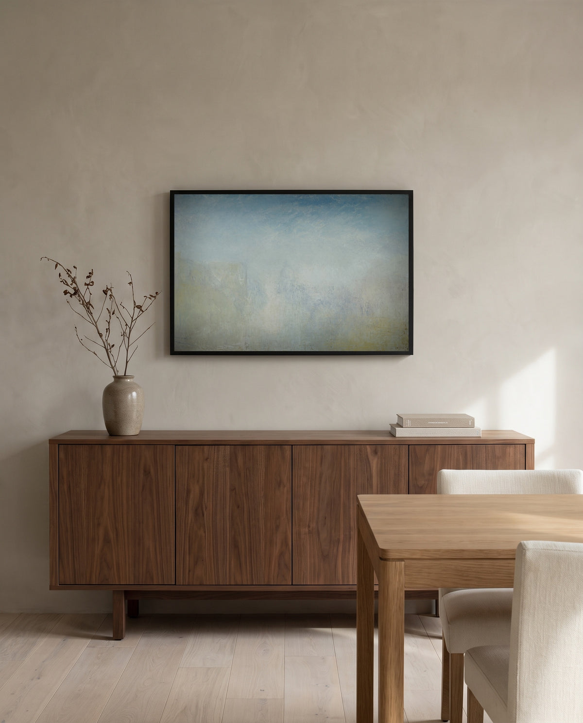 Venice with the Salute by J. M. W. Turner in a black frame above a walnut sideboard in a dining room