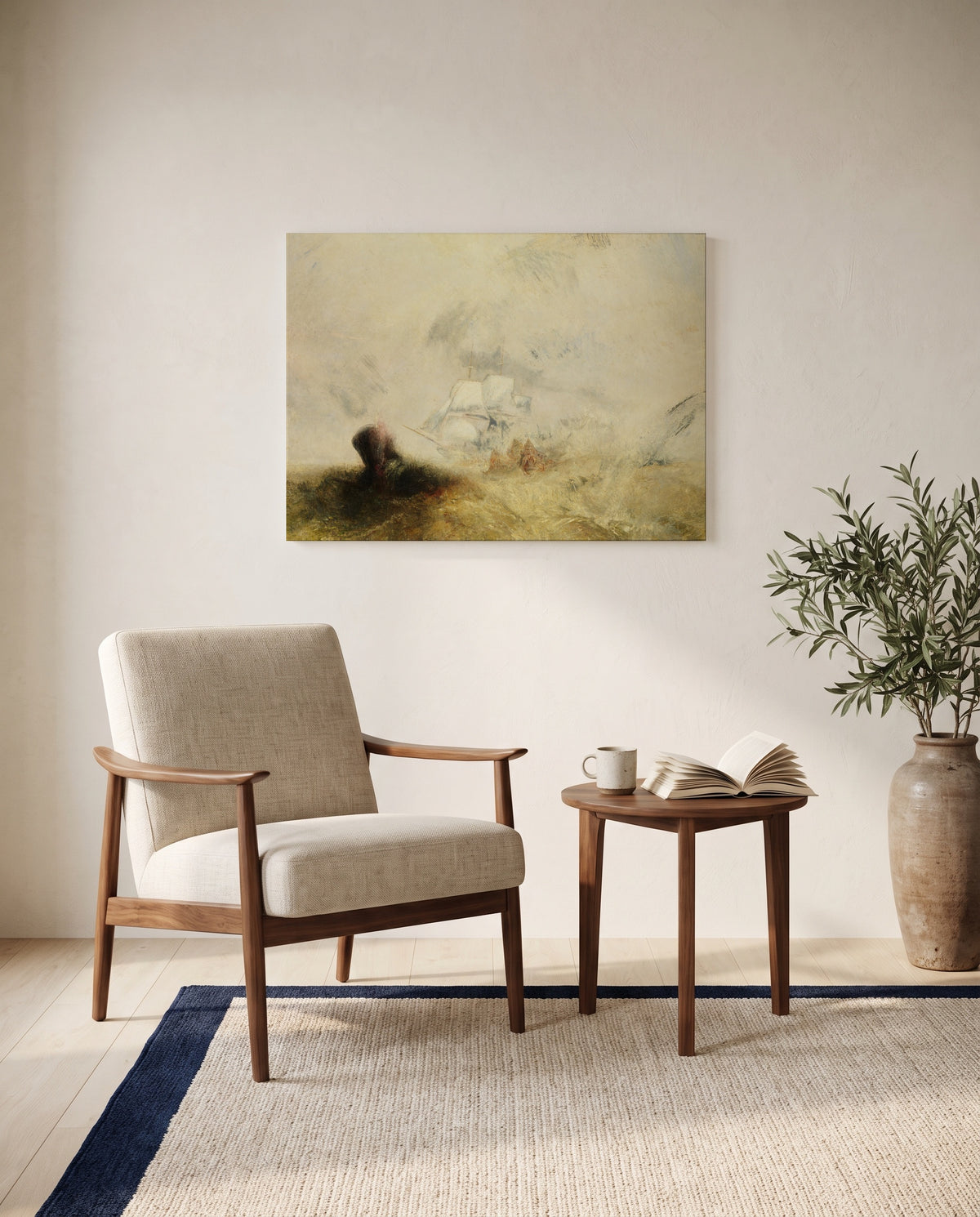 Whalers (The Met) by J. M. W. Turner as a stretched canvas above a linen lounge chair in a reading corner