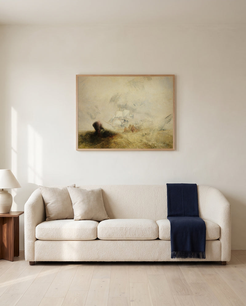 Whalers (The Met) by J. M. W. Turner framed in natural oak above a cream sofa in a warm living room