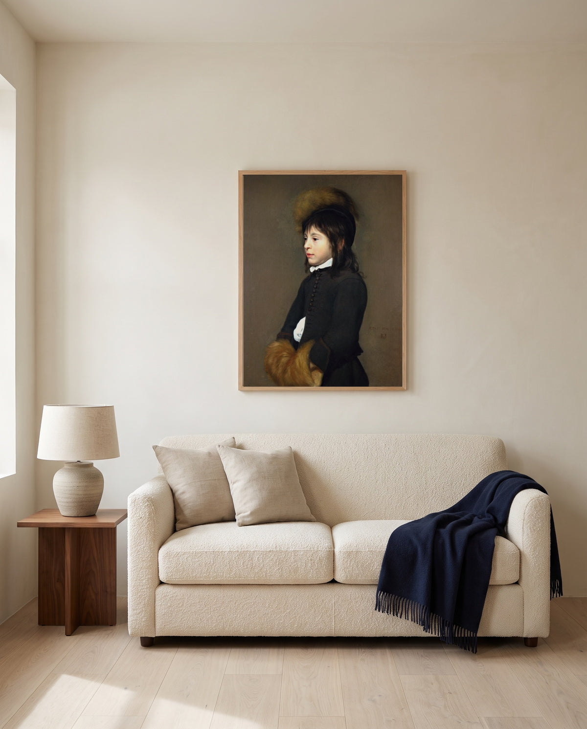 Portrait of a Boy Aged 11 by Jacob van Oost the Elder framed in natural oak above a cream sofa in a warm living room