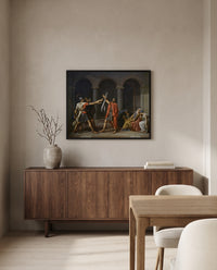 Oath of the Horatii by Jacques-Louis David in a black frame above a walnut sideboard in a dining room