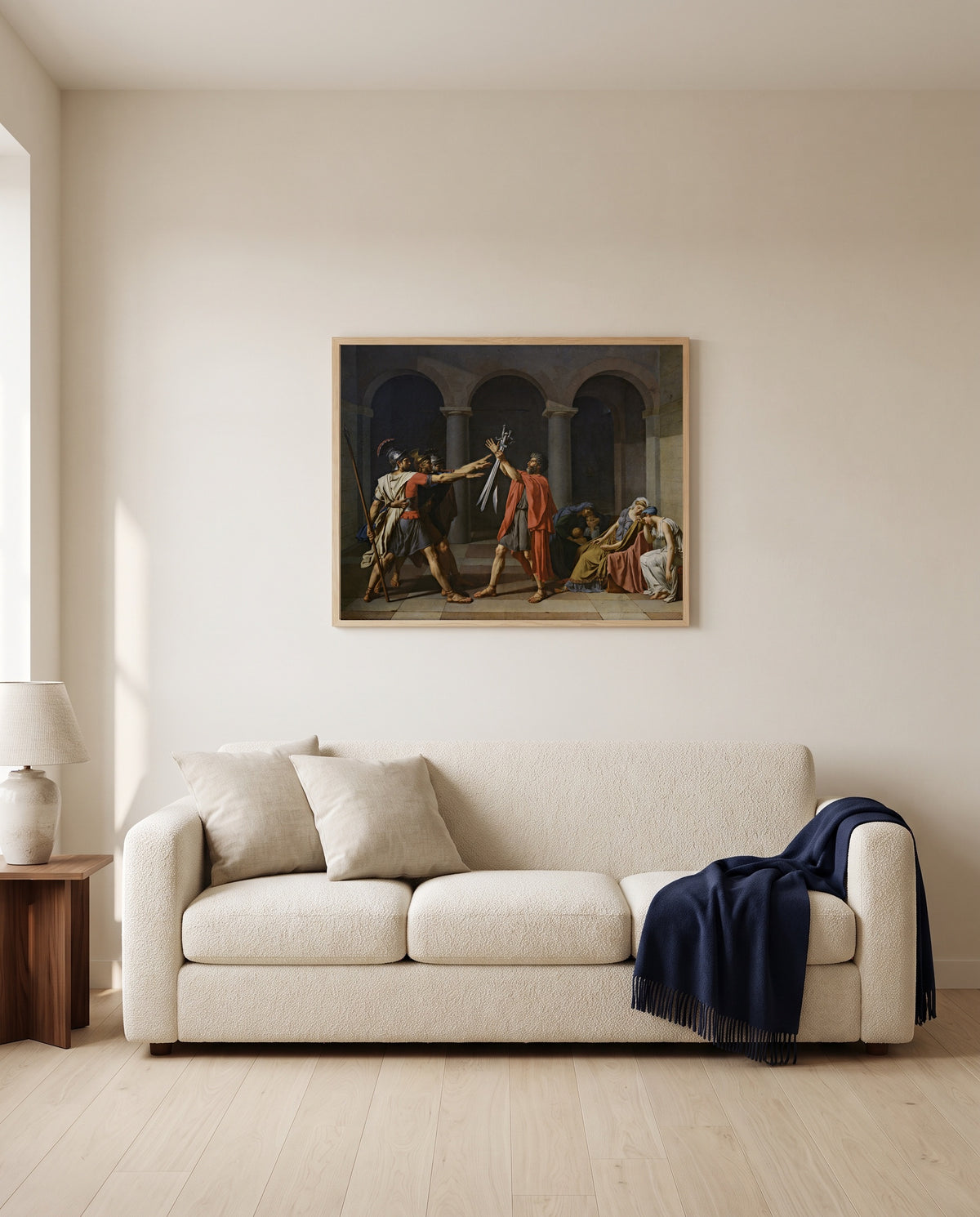 Oath of the Horatii by Jacques-Louis David framed in natural oak above a cream sofa in a warm living room