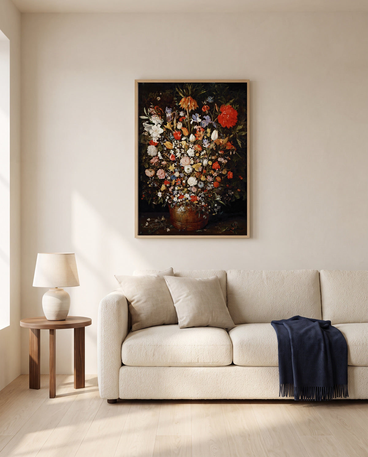 Large Bouquet of Flowers by Jan Brueghel the Elder framed in natural oak above a cream sofa in a warm living room