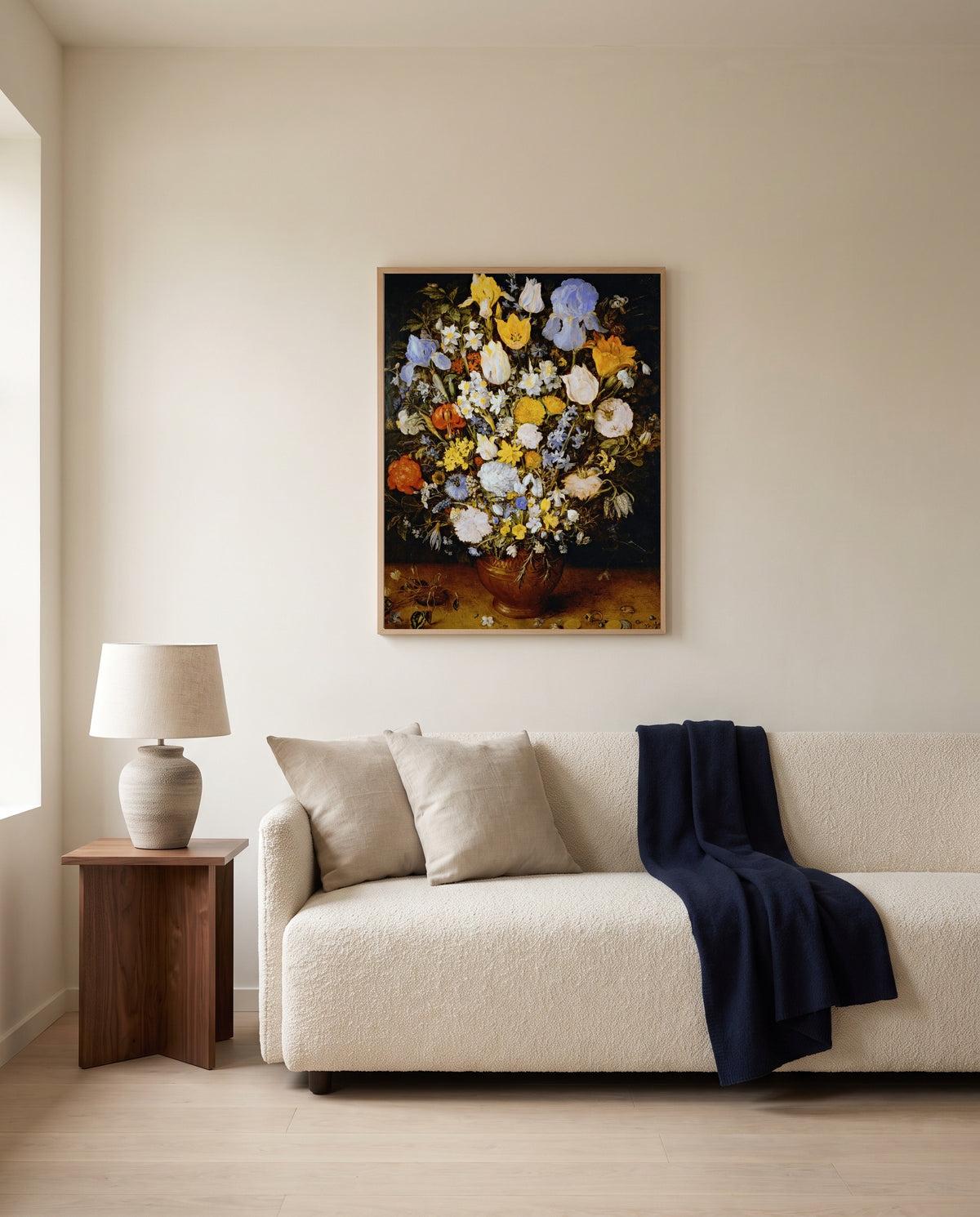 Small Bouquet of Flowers by Jan Brueghel the Elder framed in natural oak above a cream sofa in a warm living room