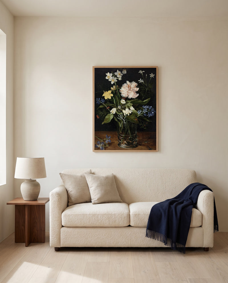 Flowers in a Glass by Jan Brueghel the Elder framed in natural oak above a cream sofa in a warm living room