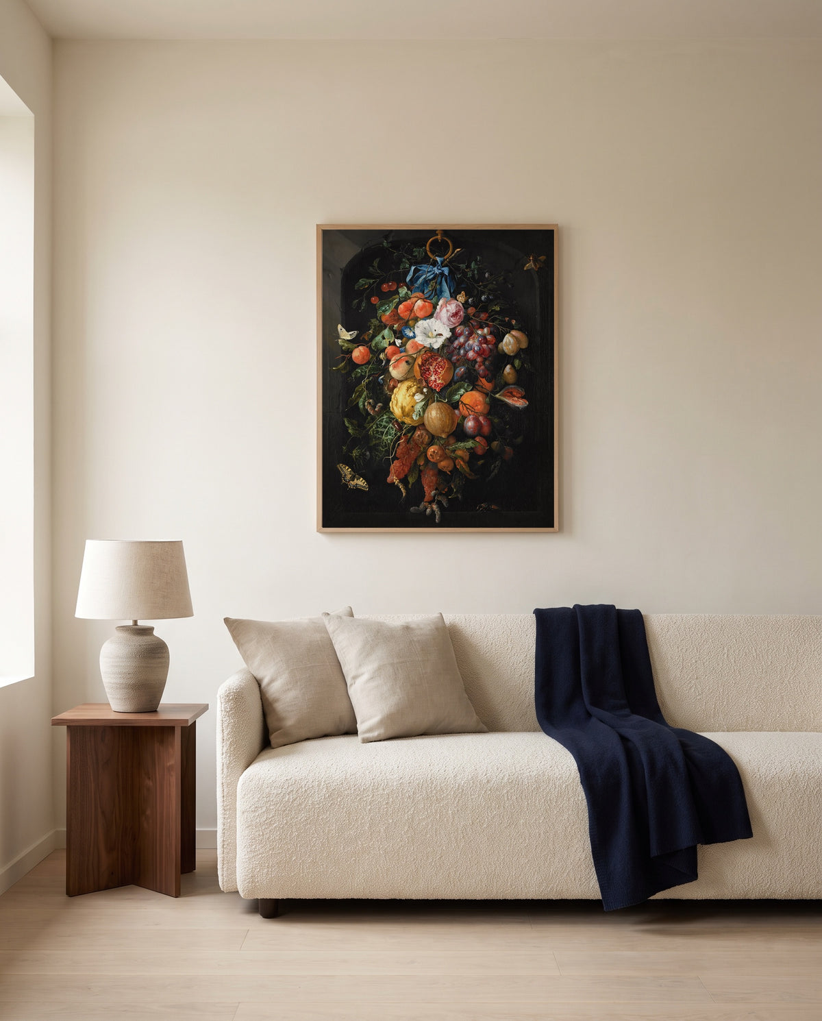 Festoon of Fruit and Flowers by Jan Davidsz. de Heem framed in natural oak above a cream sofa in a warm living room