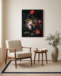 Flowers in a Glass Vase (1670) by Jan Davidsz. de Heem as a stretched canvas above a linen lounge chair in a reading corner