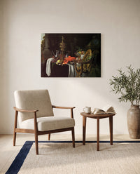 A Banqueting Scene by Jan Davidsz. de Heem as a stretched canvas above a linen lounge chair in a reading corner