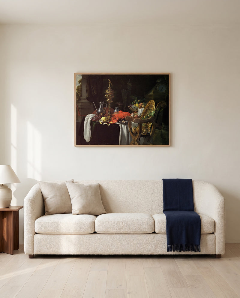 A Banqueting Scene by Jan Davidsz. de Heem framed in natural oak above a cream sofa in a warm living room