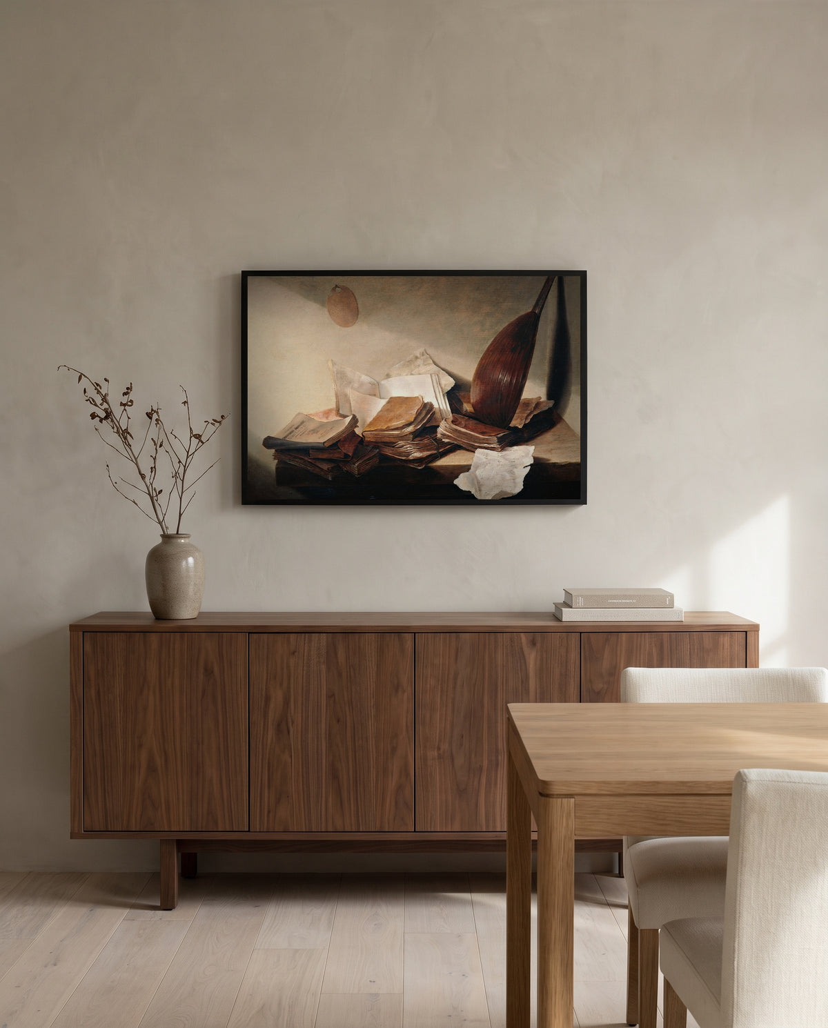 Still Life with Books by Jan Davidsz. de Heem in a black frame above a walnut sideboard in a dining room