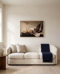 Still Life with Books by Jan Davidsz. de Heem framed in natural oak above a cream sofa in a warm living room
