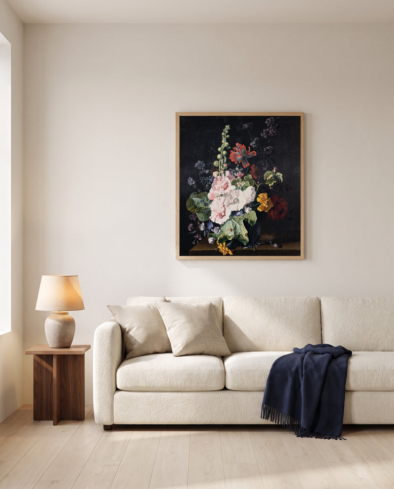 Hollyhocks in a Vase by Jan van Huysum framed in natural oak above a cream sofa in a warm living room