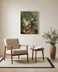 Still Life with Flowers by Jan van Huysum as a stretched canvas above a linen lounge chair in a reading corner