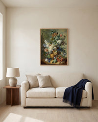 Still Life with Flowers by Jan van Huysum framed in natural oak above a cream sofa in a warm living room