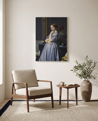 Comtesse d’Haussonville by Jean-Auguste-Dominique Ingres as a stretched canvas above a linen lounge chair in a reading corner