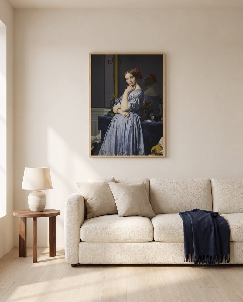 Comtesse d’Haussonville by Jean-Auguste-Dominique Ingres framed in natural oak above a cream sofa in a warm living room