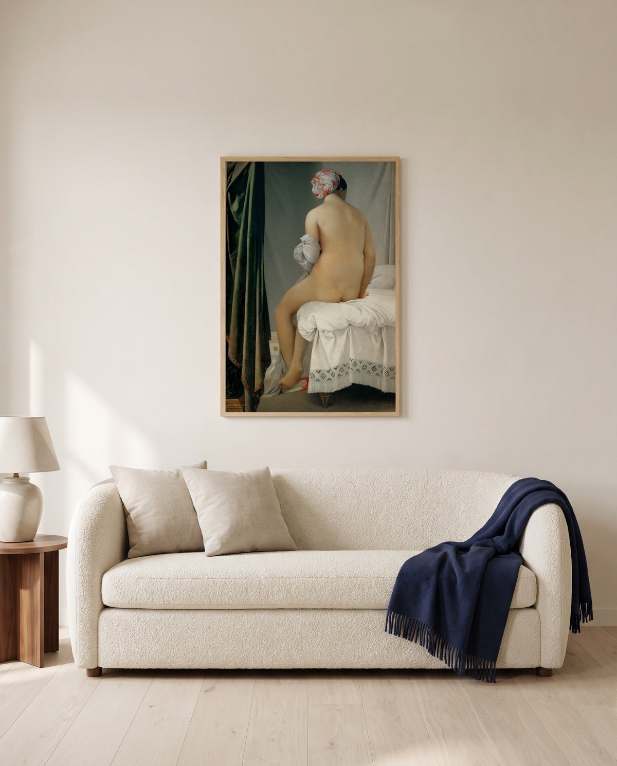 The Valpinçon Bather by Jean-Auguste-Dominique Ingres framed in natural oak above a cream sofa in a warm living room