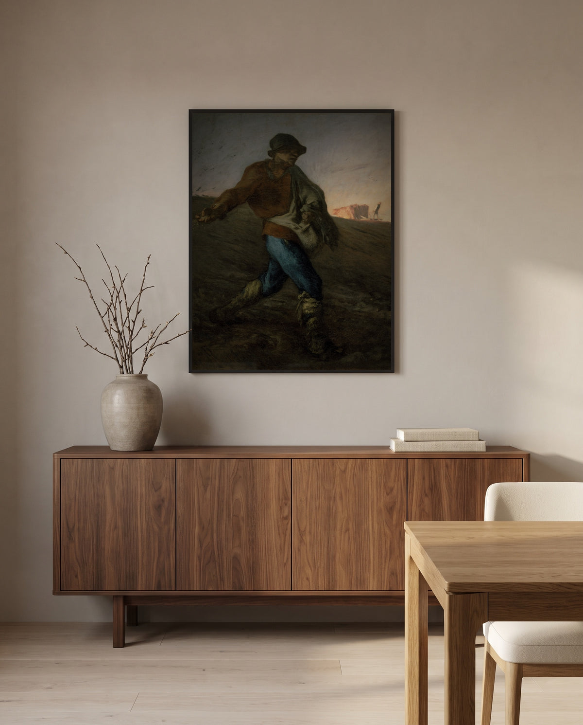 The Sower by Jean-François Millet in a black frame above a walnut sideboard in a dining room
