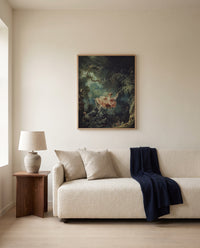 The Swing by Jean-Honoré Fragonard framed in natural oak above a cream sofa in a warm living room