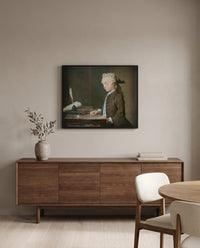 Boy with a Spinning-Top by Jean Siméon Chardin in a black frame above a walnut sideboard in a dining room