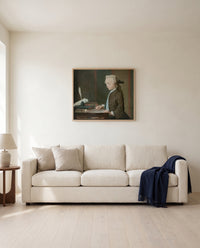 Boy with a Spinning-Top by Jean Siméon Chardin framed in natural oak above a cream sofa in a warm living room