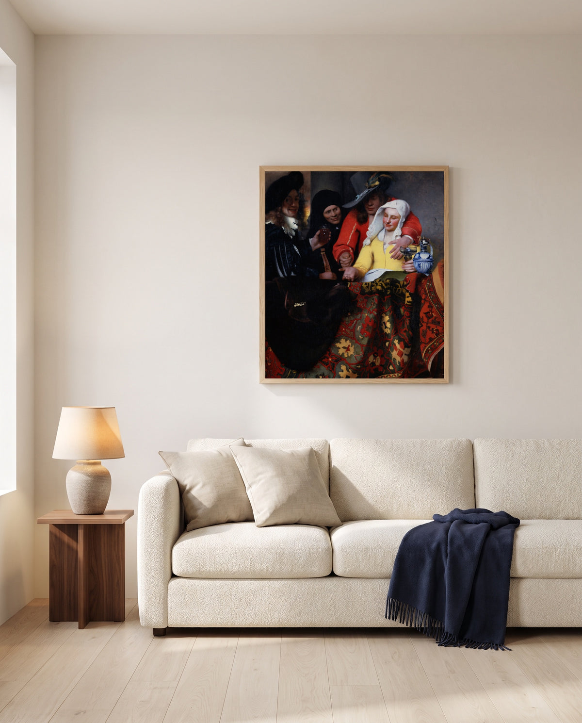 The Procuress by Johannes Vermeer framed in natural oak above a cream sofa in a warm living room