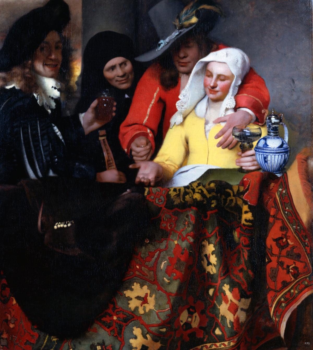 The Procuress by Vermeer: a soldier in red, a young woman in yellow with a glass, an old woman and a smiling man over a rug