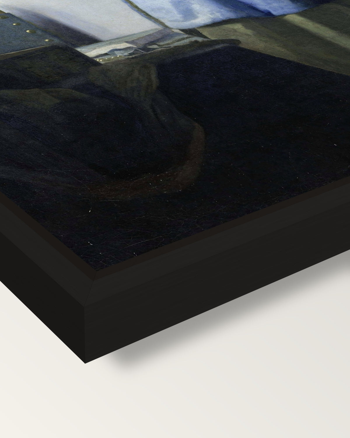 Woman in Blue Reading a Letter framed canvas, corner close-up: a black floating frame with a shadow gap round the canvas