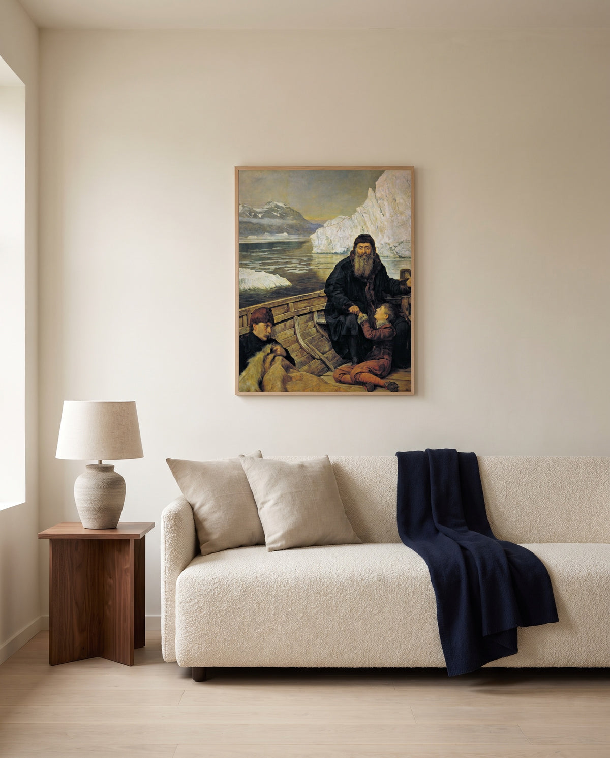 Last Voyage of Henry Hudson by John Collier framed in natural oak above a cream sofa in a warm living room