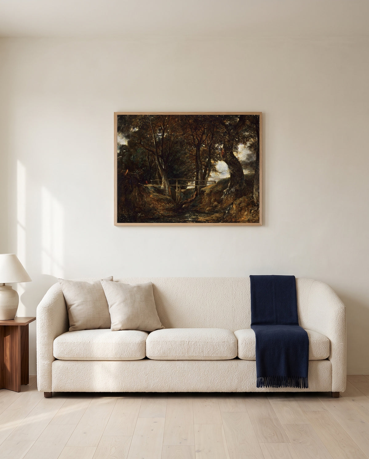 Dell at Helmingham Park by John Constable framed in natural oak above a cream sofa in a warm living room